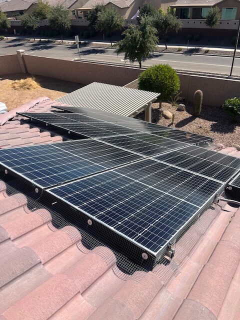 Solar-Panel-Bird-Proofing-Mesh-scottsdale-AZ-Installation - depalmasresidentialservices.com Technicians installing solar panel bird proofing mesh in scottsdale, Az.