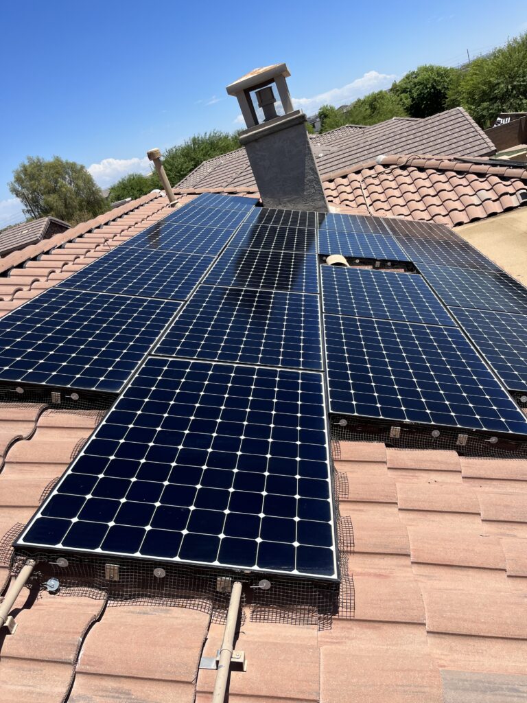 Technicians installing solar panel bird proofing mesh in El Mirage, Az.